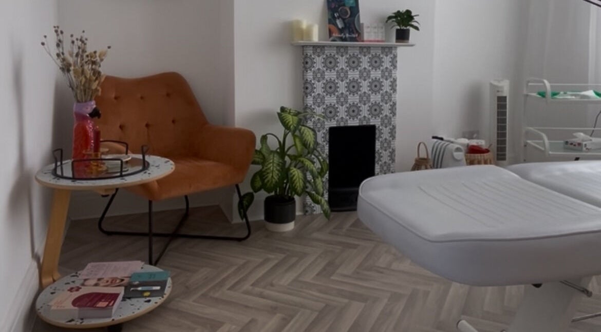 Inviting treatment room at Fresh Faced in Grimsby, England, GB, featuring a plush chair and elegant decor.