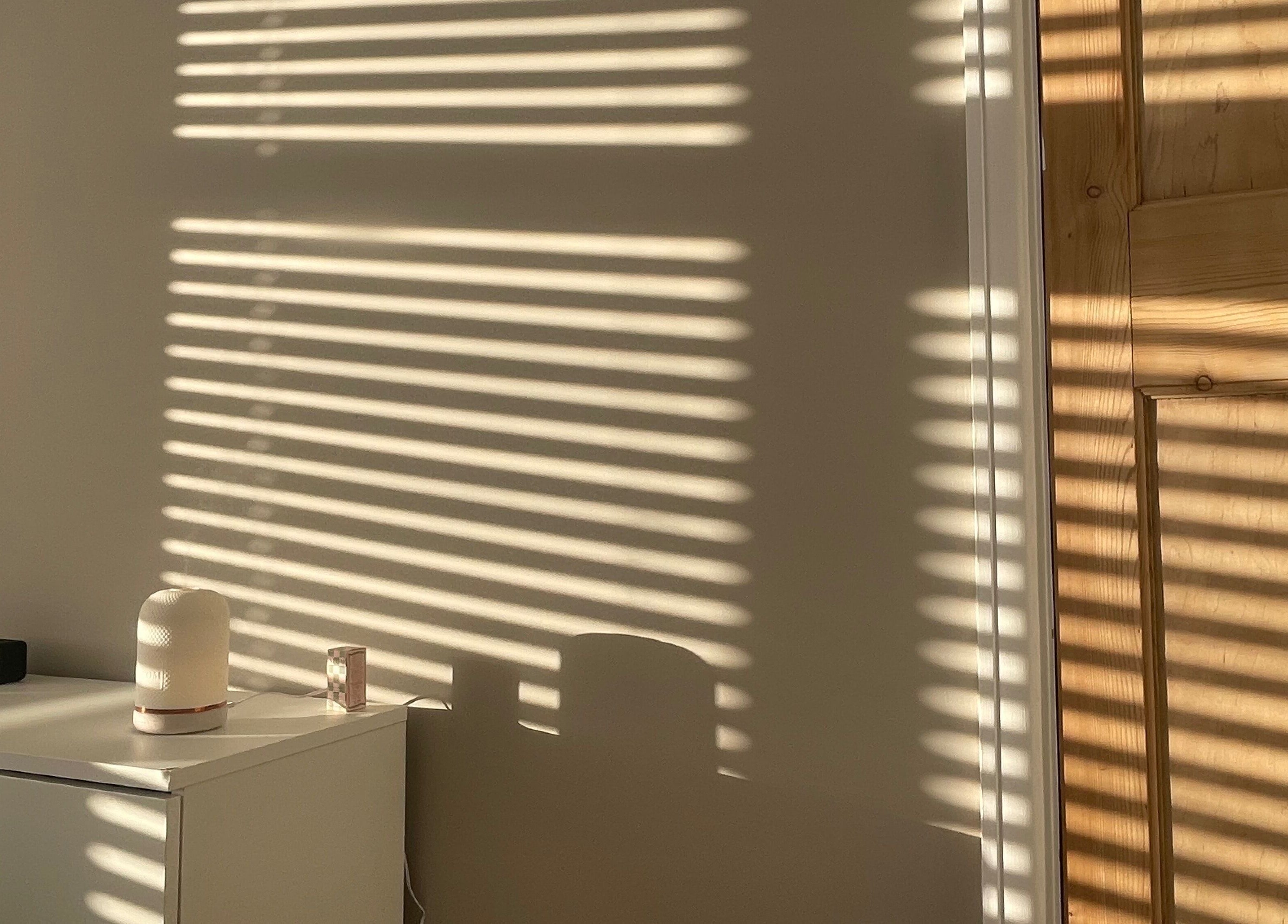 Soft shadows from blinds cast on a calming room at Fresh Faced, Grimsby, England, GB.