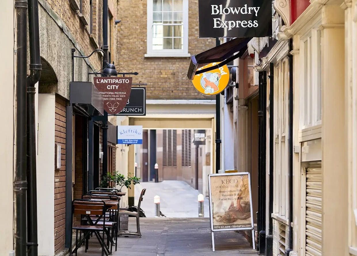Entrance to Blow Dry Express - Monument in a quaint London passageway, United Kingdom, GB.