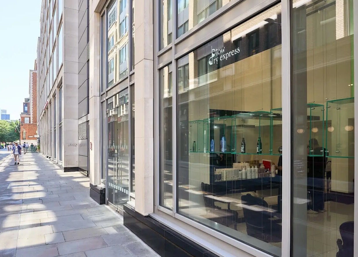 Exterior view of Blow Dry Express - St Pauls, London, United Kingdom, featuring modern glass windows.