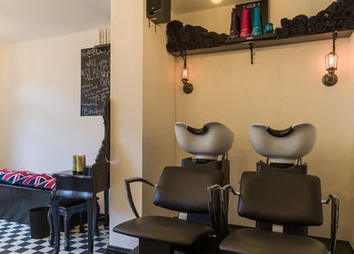 Chic interior of Blow Dry Express - Liverpool Street salon in London, United Kingdom, GB with modern wash stations.