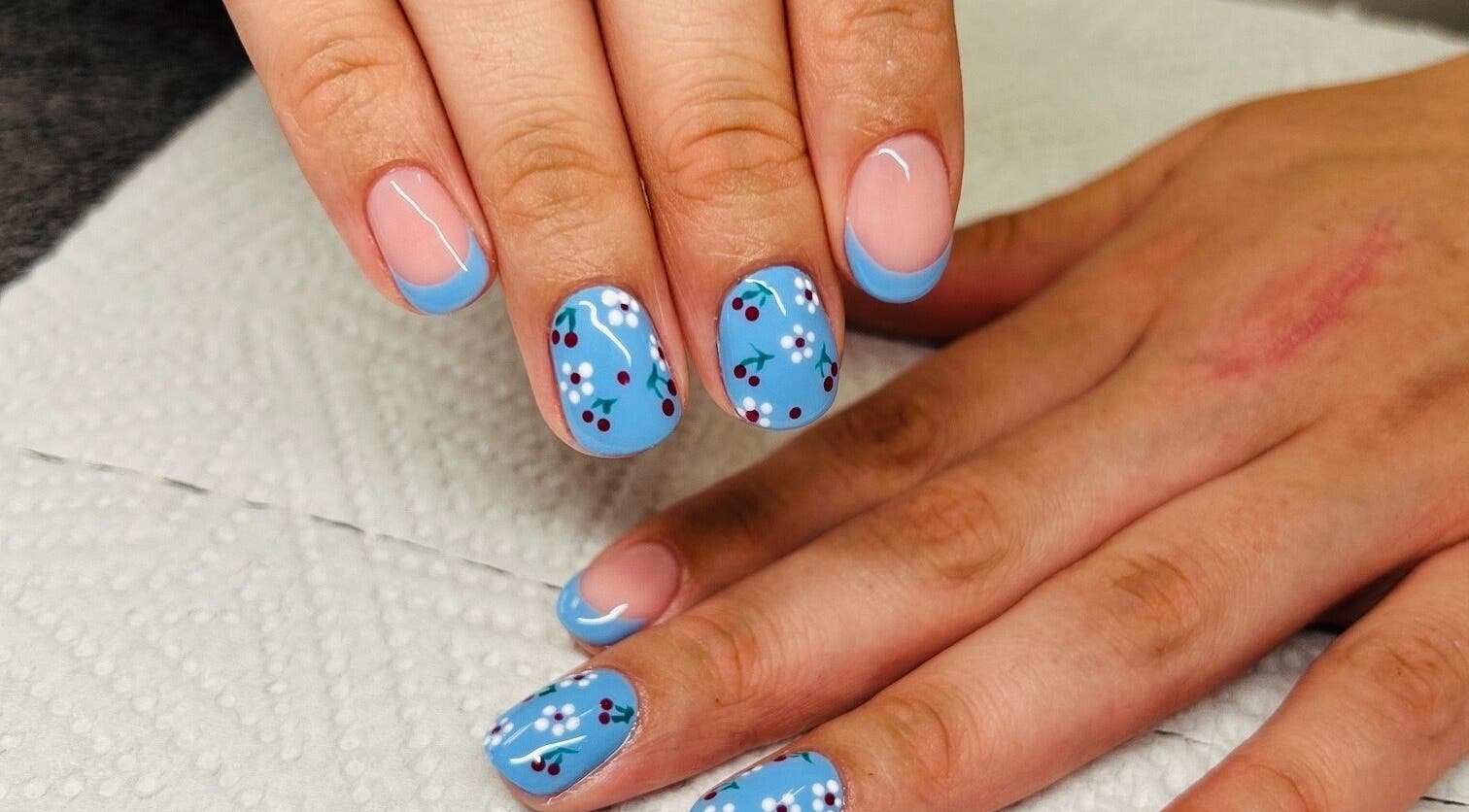 Blue floral nail art at Gloow Nails, Randburg, Gauteng, ZA, showcasing intricate design and creativity.