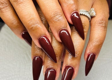Stunning bordeaux stiletto nails at Gloow Nails, Randburg, Gauteng, ZA. Perfect manicure for elegance.