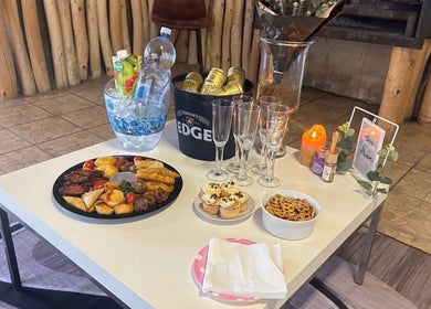 Elegant snack setup with drinks at Tiara's Beauty Spa, Cape Town, Western Cape, ZA, highlighting a relaxing atmosphere.