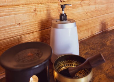 Aromatic oils and a dispenser on a wooden table at Saltwoods Healing & Massage, Herne Bay, England, GB.