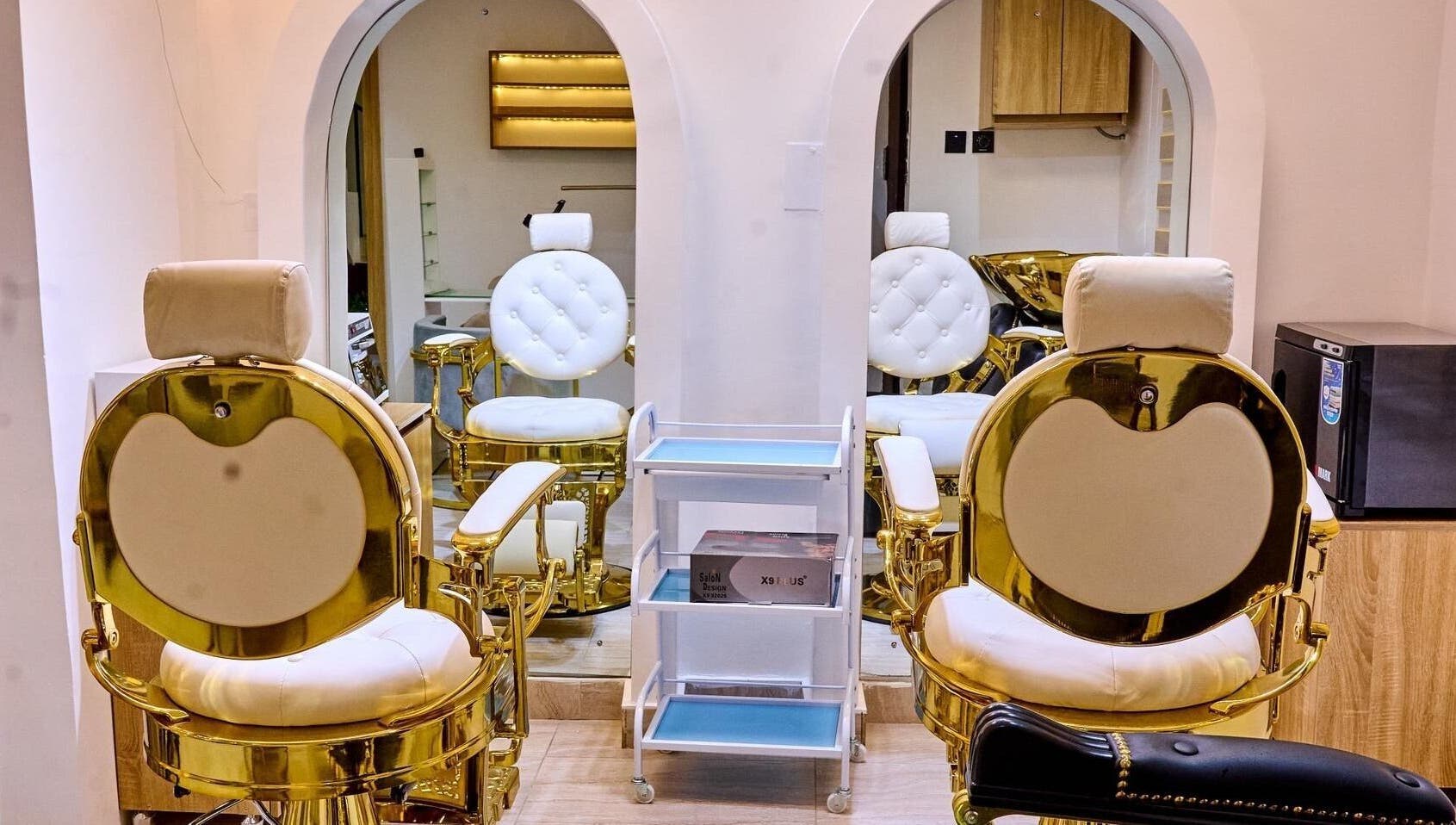 Luxurious gold and white salon chairs at Trosuitmedspa, Ikeja, Lagos, NG, enhance its elegant ambiance.