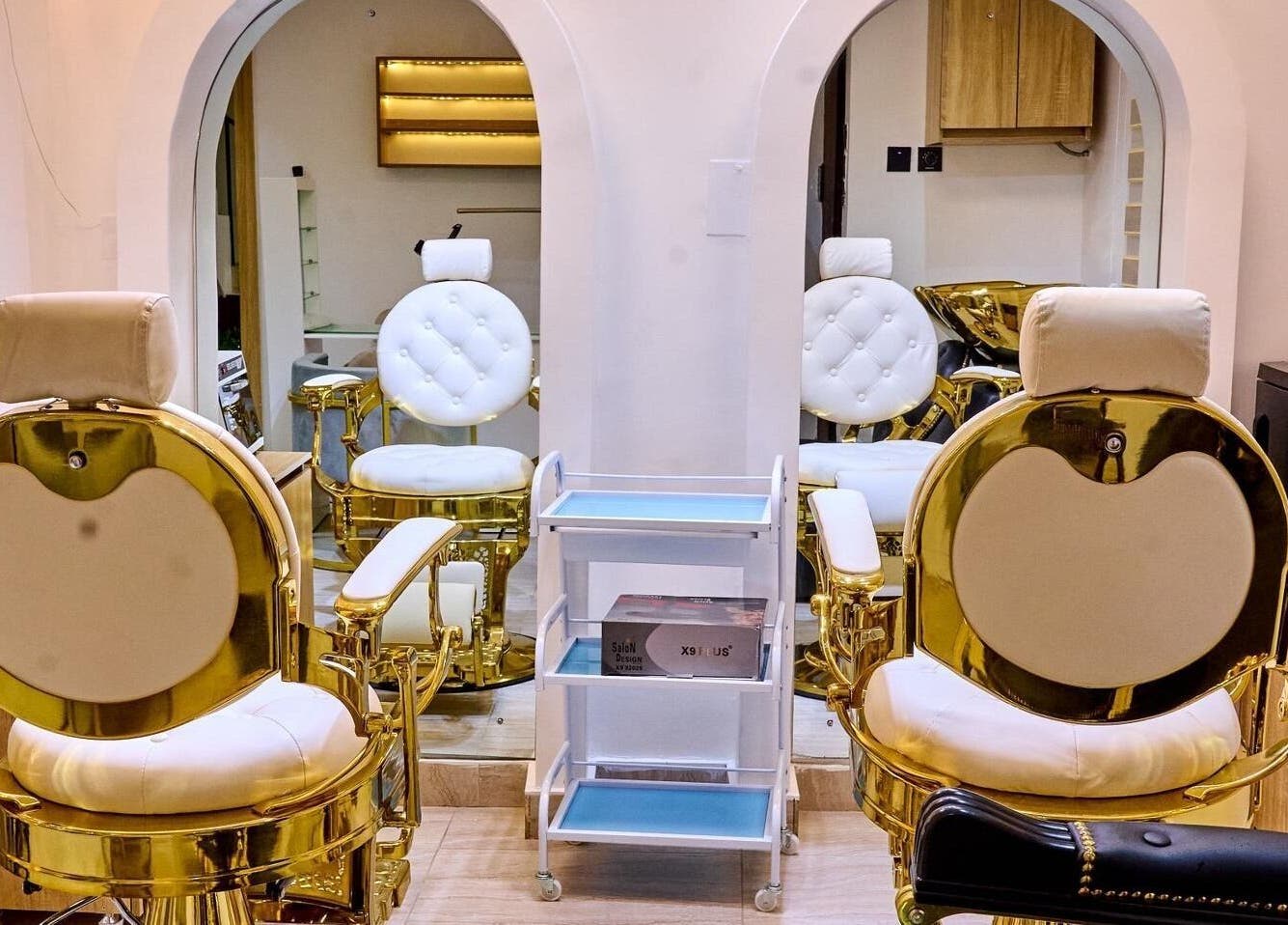 Luxurious gold and white salon chairs at Trosuitmedspa, Ikeja, Lagos, NG, enhance its elegant ambiance.