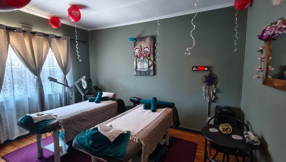 Relaxing massage room at The Masked Spa Mobile in Gansbaai, Western Cape, ZA with two treatment tables.