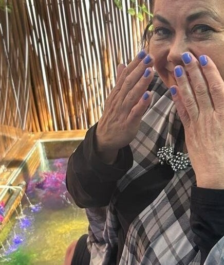 Happy client enjoying a spa session at The Masked Spa Mobile, Gansbaai, Western Cape, ZA.