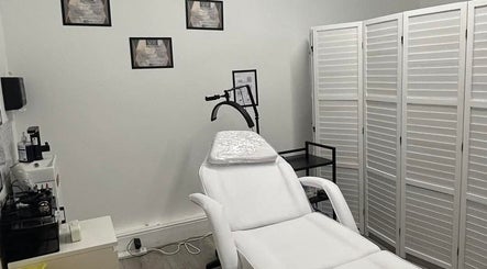 Elegance Permanent Makeup treatment room in Nottingham, England, GB featuring a white treatment chair.