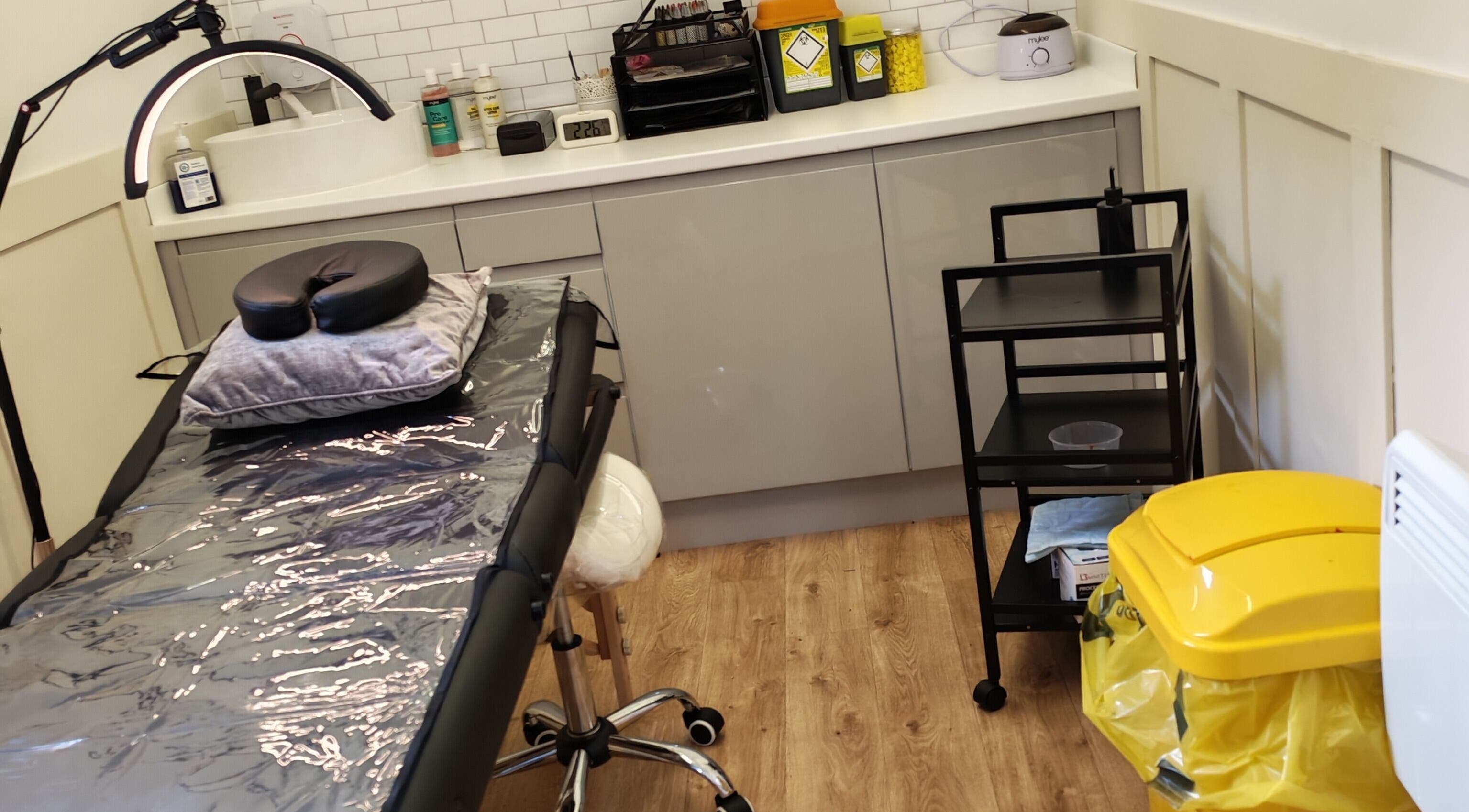 Modern treatment room at Elegance Permanent Makeup, Kirkby In Ashfield, England, GB with sleek furnishings.