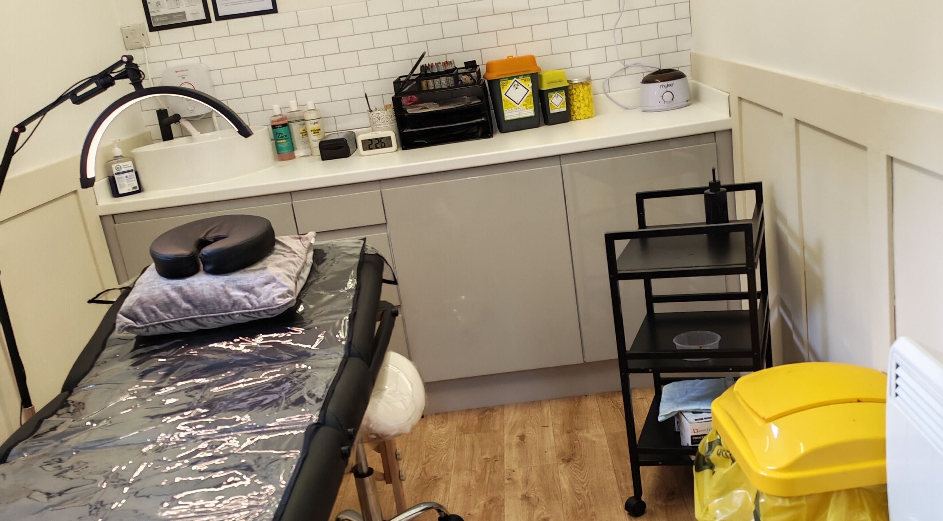 Elegance Permanent Makeup studio in Kirkby In Ashfield, England, showing a treatment table and equipment.