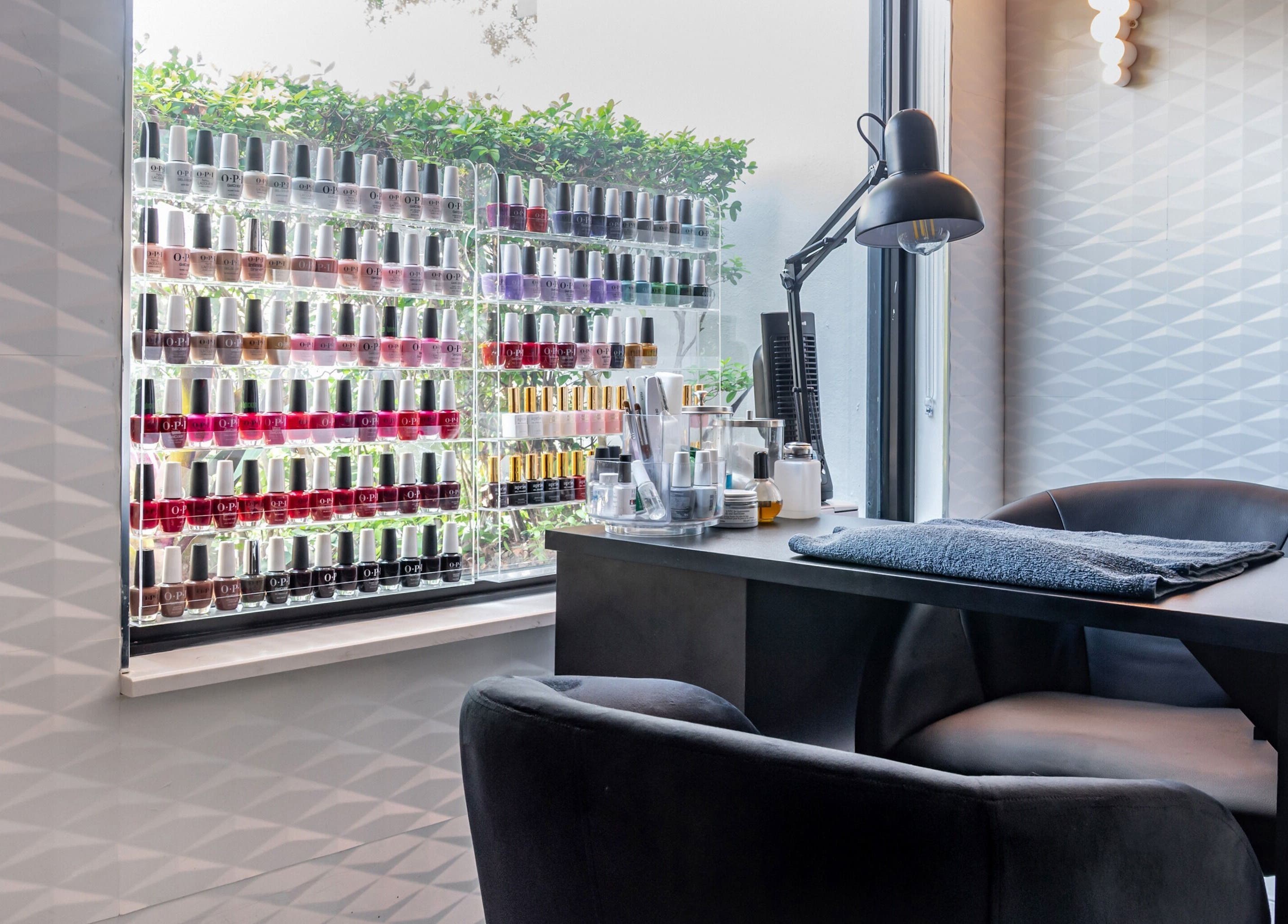 Nail polish display and manicure station at MG Hair Studios, Coral Gables, Florida, US.