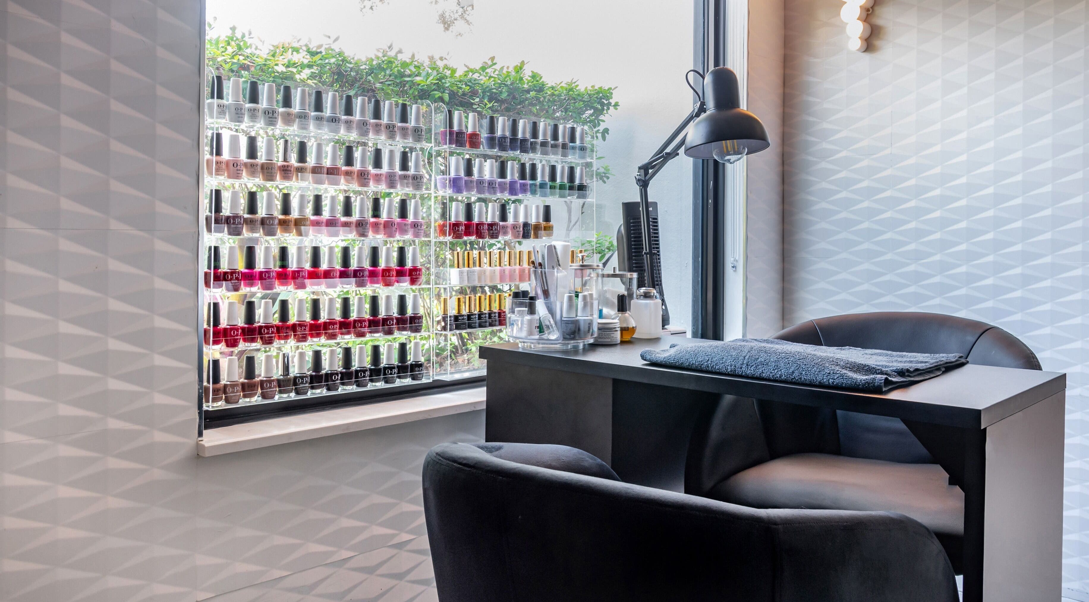 Nail polish display and manicure station at MG Hair Studios, Coral Gables, Florida, US.