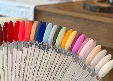Colorful nail polish samples at AmiRoseBeauté, Barrington, England, GB, showcasing diverse shade options.
