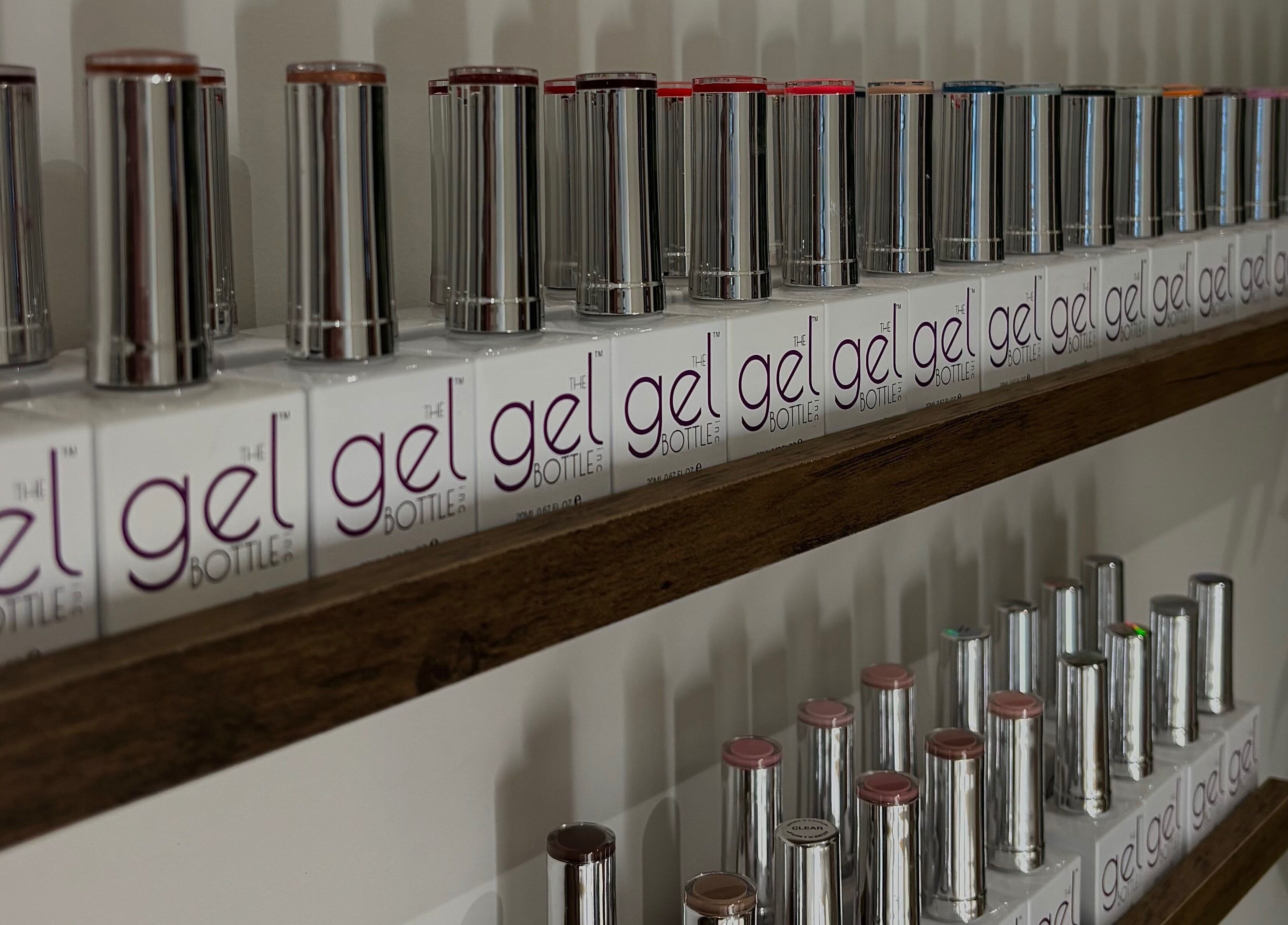 Elegant gel polish display at AmiRoseBeauté, Barrington, England, GB showcasing vibrant nail colors.