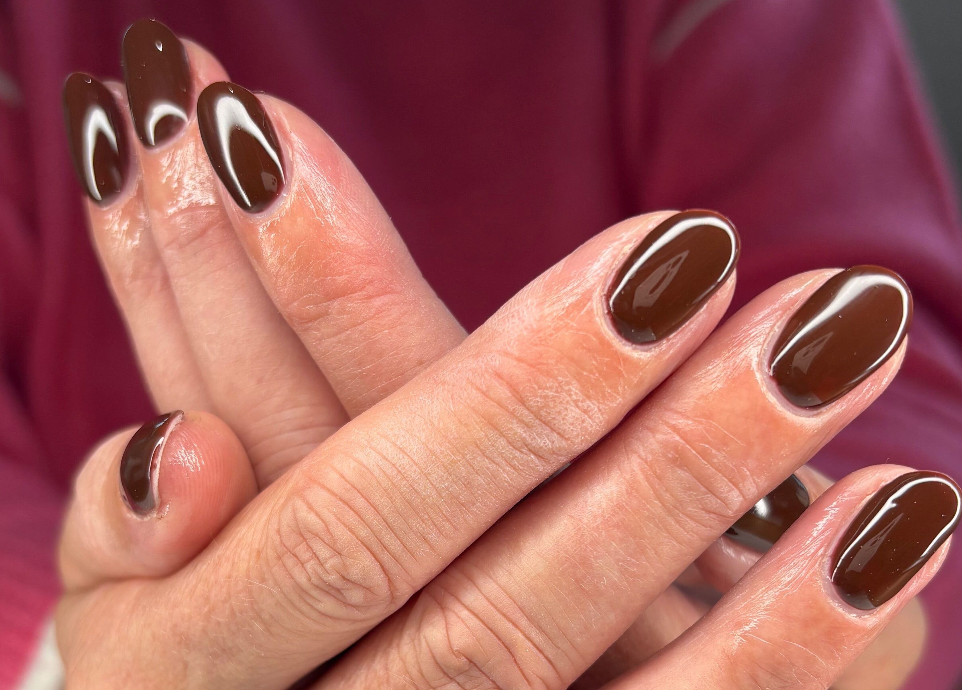 Elegant brown polished nails at AmiRoseBeauté, Barrington, England, GB. Perfect manicure for style and sophistication.