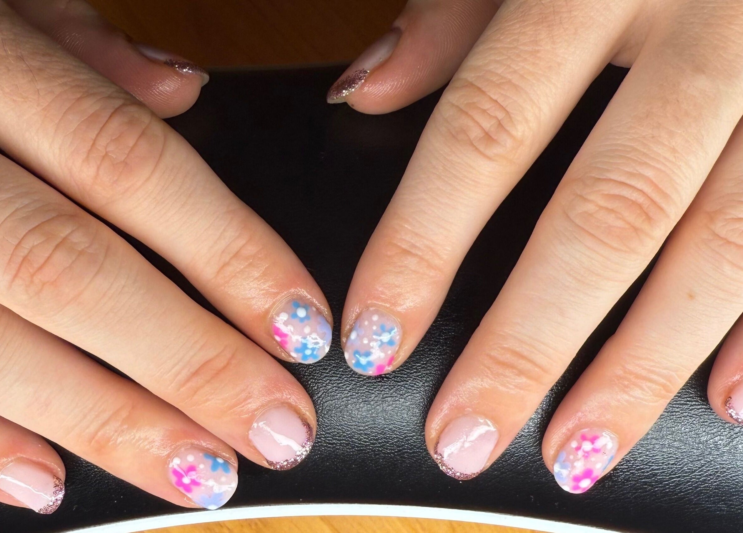 Colorful floral nail art at Mindful Beauty, Lochmaben, Scotland, GB. Enhance your style with unique designs.