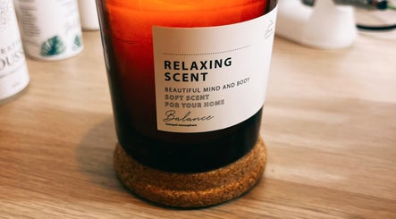 Relaxing scented candle at Lola Nail Aesthetics, Chadderton, England, GB, offering calming ambiance.