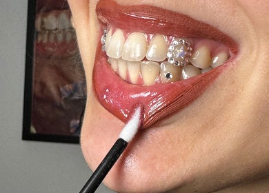Close-up of a vibrant lipstick application at Face Couture, London, England, GB.