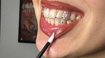 Close-up of a vibrant lipstick application at Face Couture, London, England, GB.