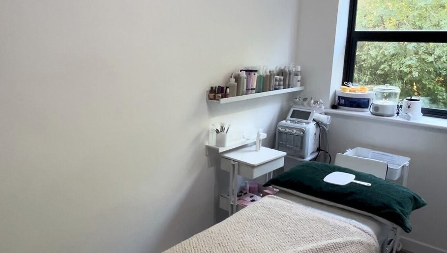 Relaxing spa room at MYAB London, located in Stanmore, England, GB, with treatment table and skincare products.