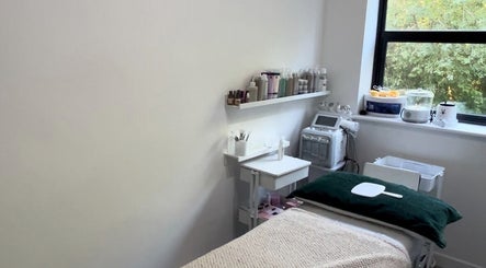 Relaxing spa room at MYAB London, located in Stanmore, England, GB, with treatment table and skincare products.