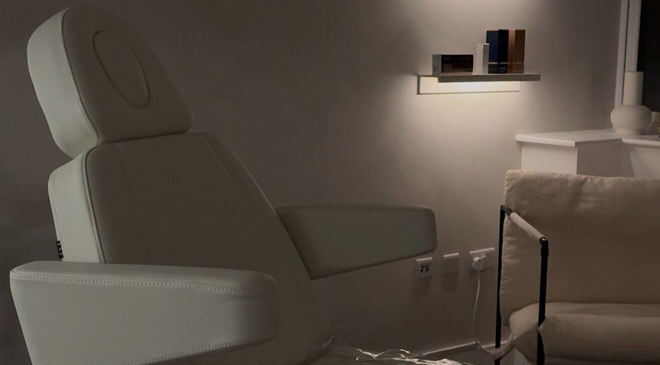 Relaxing treatment chair at SNC Skin Clinic, Edgware, England, GB, offering tranquil wellness services.