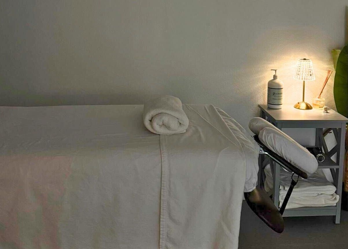 Serene massage room at Kaizen Massage Studio, Stella, Rincón, Rincón, PR, featuring a prepared massage table.