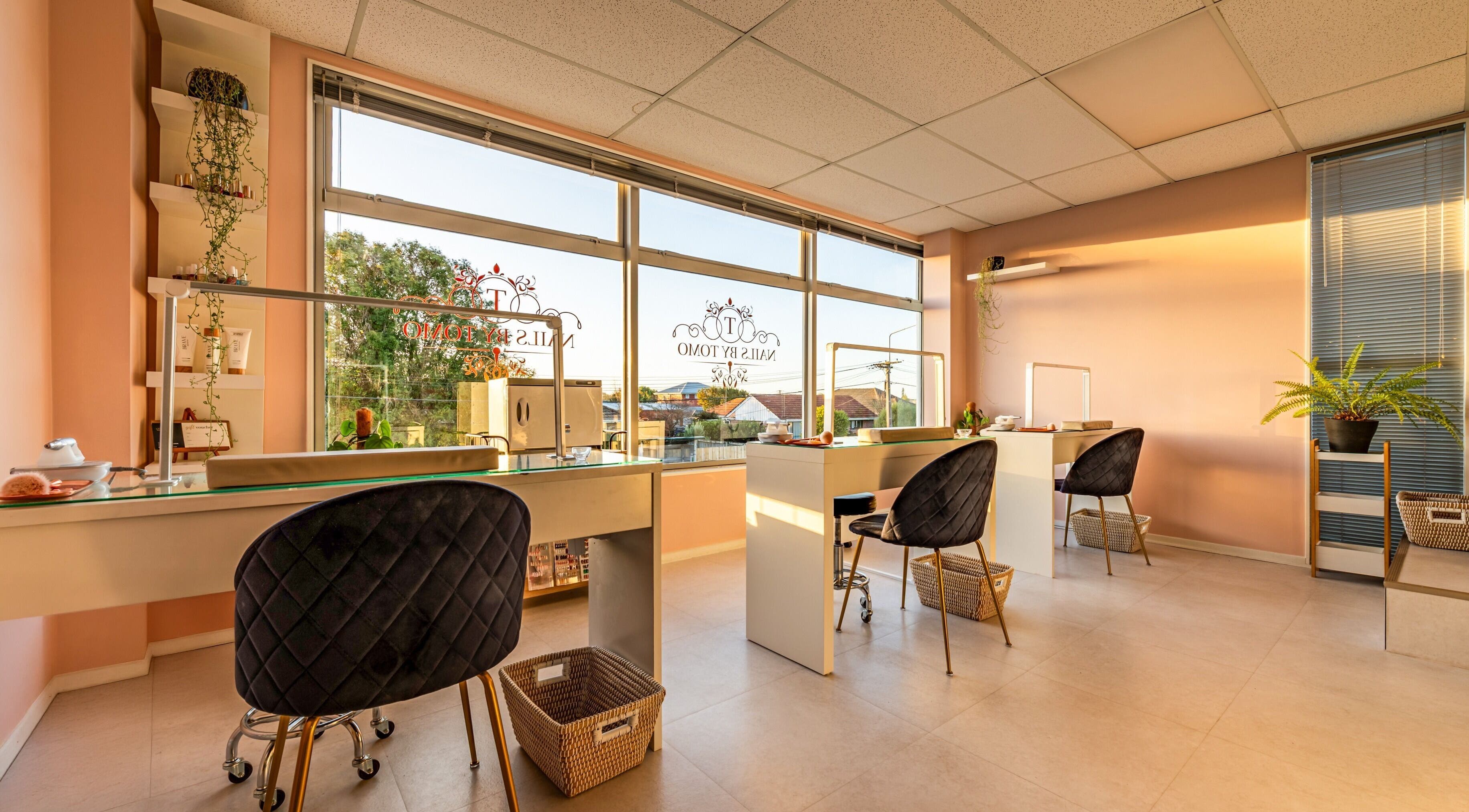 Bright interior of Nails by Tomo ltd in Christchurch, Canterbury Region, NZ with modern decor and ample seating.