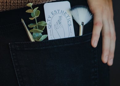 QLTY ESTHETICS card, brushes, and plant in pocket at Nanaimo, British Columbia, CA.