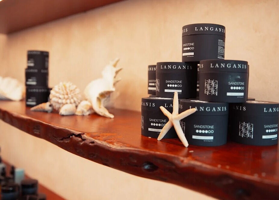 Luxurious grooming products on display at Waves Barbershop, West End, Queensland, AU, with a beach theme.