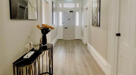 Elegant hallway at The Contour Method in Melbourne, Victoria, AU featuring modern decor and artistic touches.