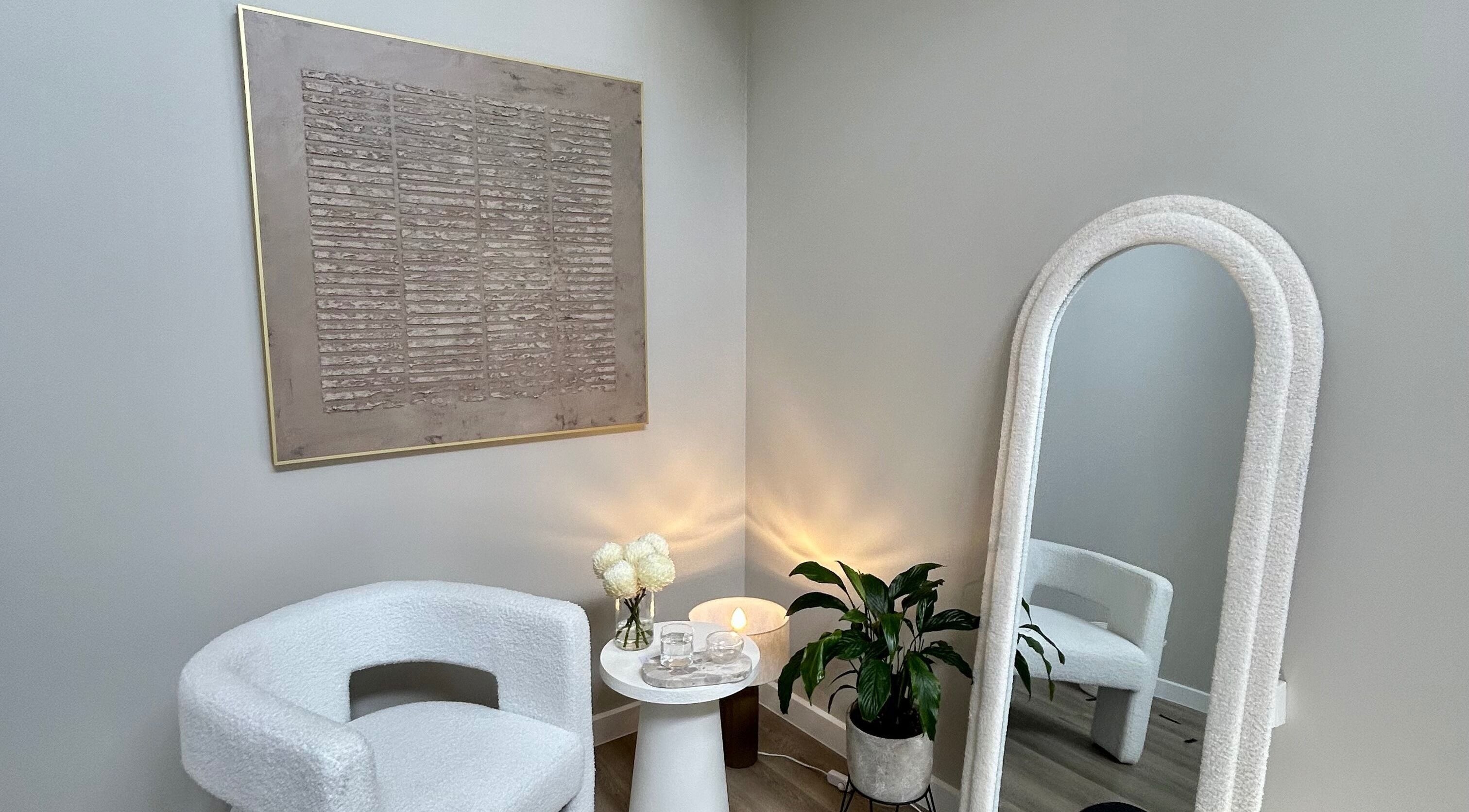 Relaxing corner at The Contour Method in Melbourne, Victoria, AU with elegant chair and decorative mirror.