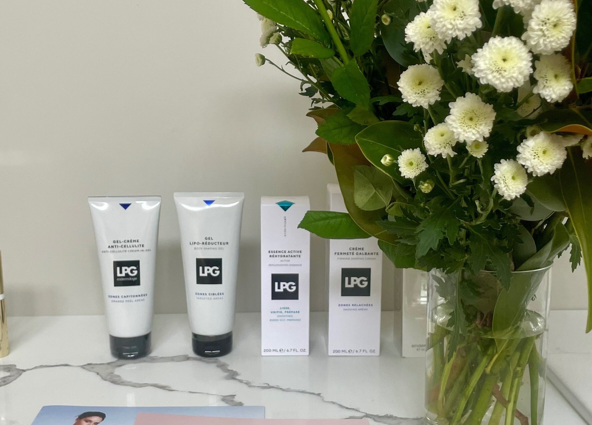 Beauty products and flowers at The Contour Method, Melbourne, Victoria, AU, showcasing elegance and care.