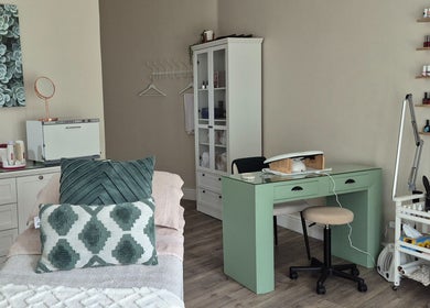 Stylish treatment room at Equilibrium Beauty Salon, Cape Town, Western Cape, ZA, with manicure setup and skincare products.