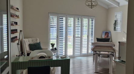 Bright treatment room at Equilibrium Beauty Salon, Cape Town, Western Cape, ZA with comfy chair and nail polishes.