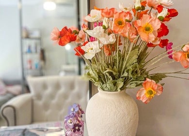 Vibrant flowers in a vase at The Lengthy co., Pimpama, Queensland, AU. Cozy beauty and wellness setting.