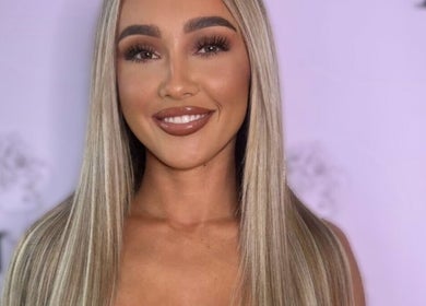 Smiling woman with sleek hair at The Lengthy co., Pimpama, Queensland, AU, showcasing elegant style.