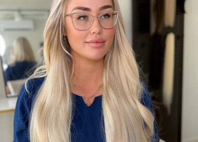 Blonde woman with glasses at The Lengthy co. salon in Pimpama, Queensland, AU.