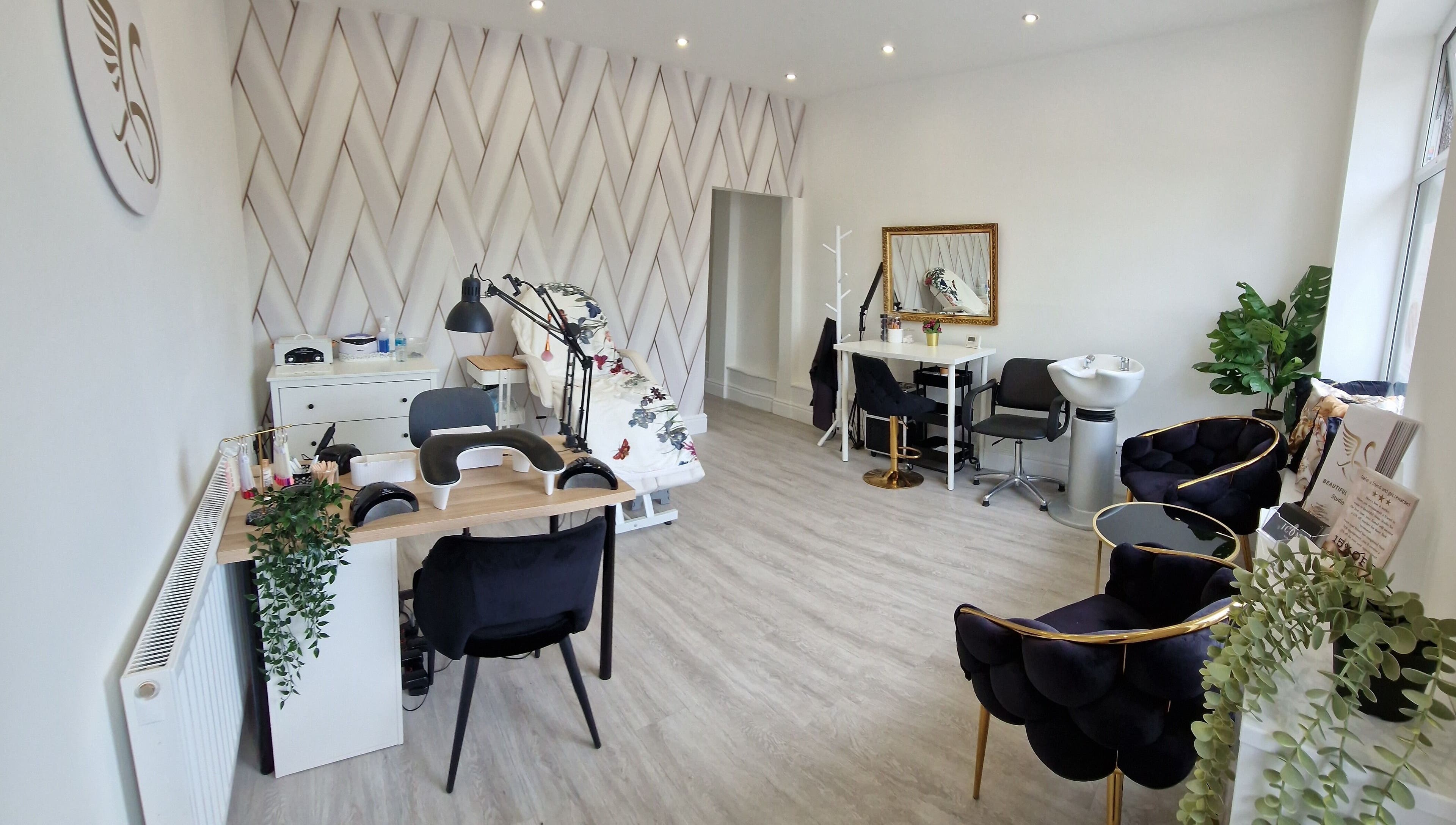 Bright, stylish interior of Beautiful Swan Studio, Swinton, England, GB with manicure and styling stations.