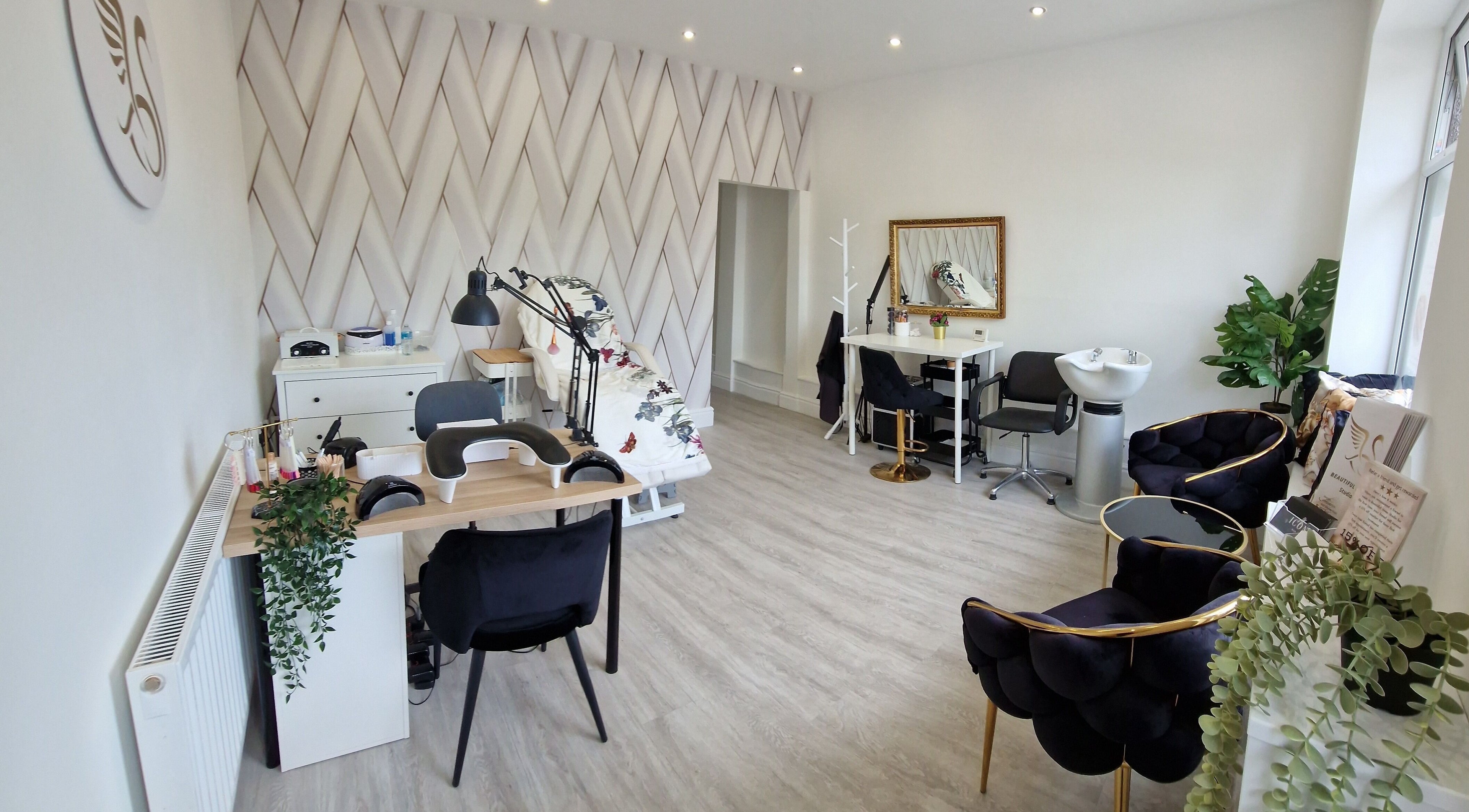 Bright, stylish interior of Beautiful Swan Studio, Swinton, England, GB with manicure and styling stations.