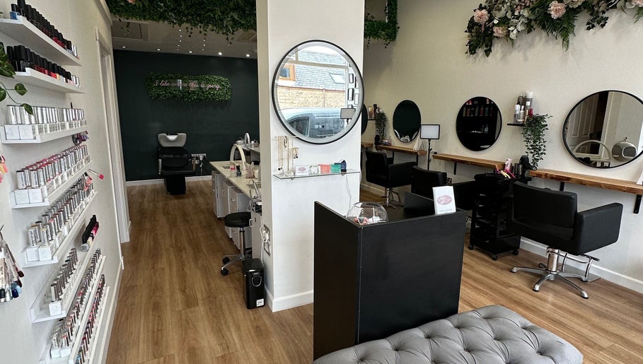 Interior of CL Beauty & Wellness, Lossiemouth, Scotland, GB, showcasing nail polish displays and salon chairs.