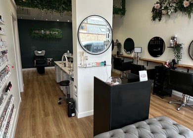 Interior of CL Beauty & Wellness, Lossiemouth, Scotland, GB, showcasing nail polish displays and salon chairs.