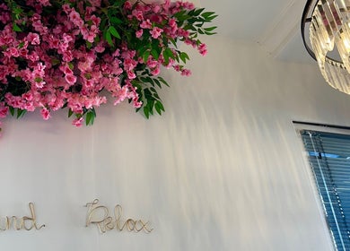 Charming pink blossoms and chandelier at CL Beauty & Wellness, Lossiemouth, Scotland, GB inspire relaxation.