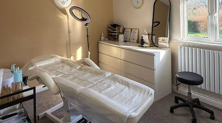Treatment room at Bee Smooth Beauty in Tonbridge, England, GB featuring a comfortable bed and modern decor.