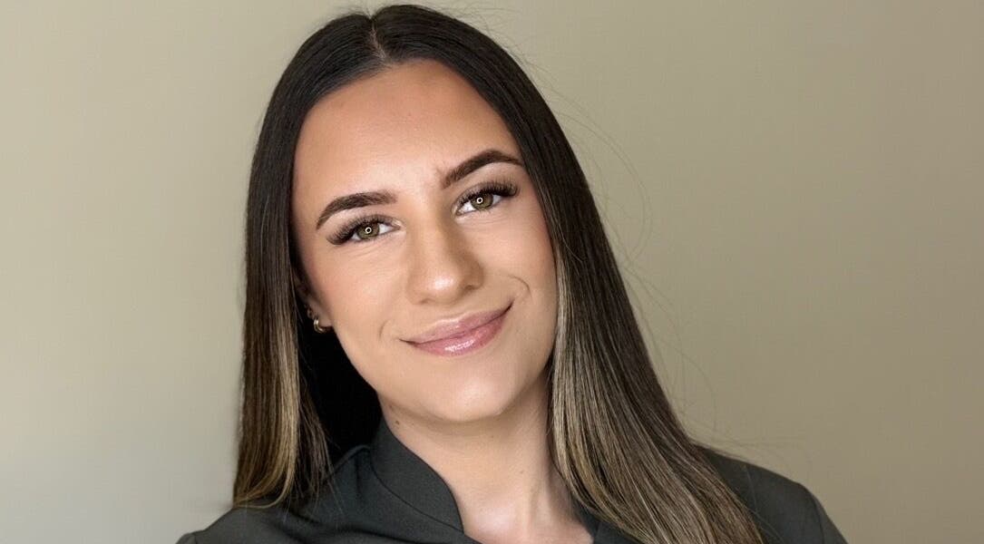 Smiling woman with sleek hair at Bee Smooth Beauty, Tonbridge, England, GB.