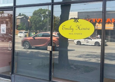Front of Emily House Nail on Avenue in North York, Ontario, CA with glass door and bright signage.