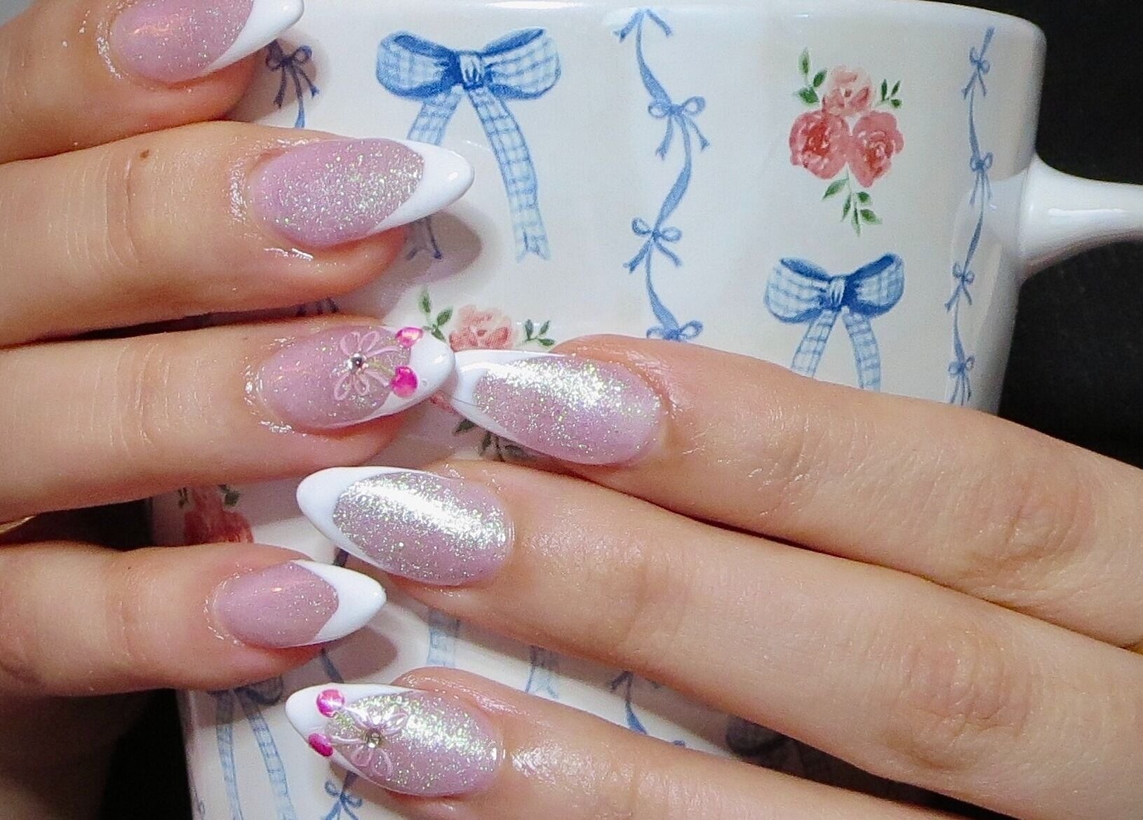 Sparkling nail art at Afterglow Esthetics Lab, Toronto, Ontario, CA, showcasing delicate nail designs.