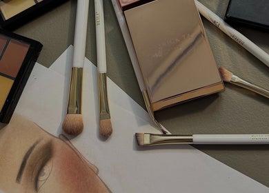 Makeup brushes and palettes at Afterglow Esthetics Lab in Toronto, Ontario, CA, showcasing beauty tools.